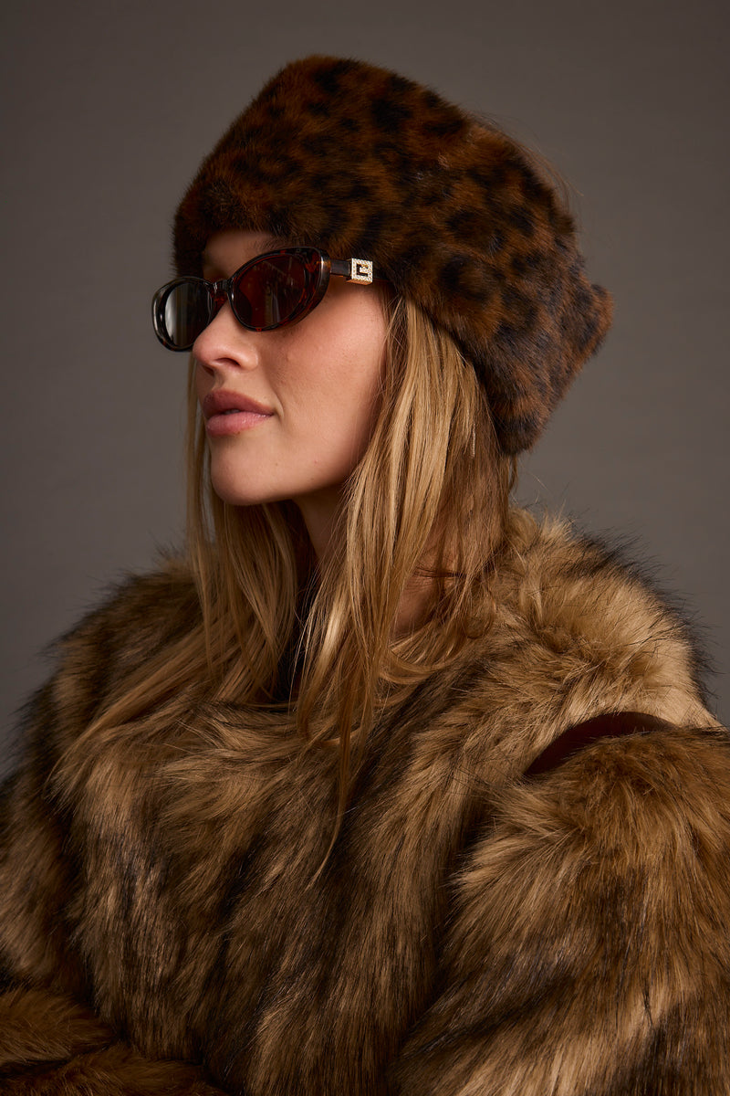 Chalet Leopard Faux Fur Headband paired with complementary accessories for a polished look.