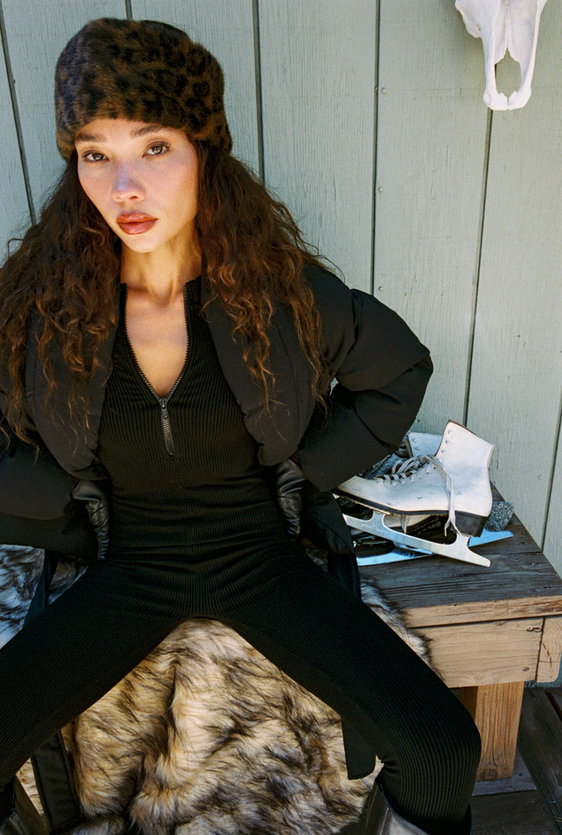 Styling option for the Chalet Leopard Faux Fur Headband shown with a complementary outfit.