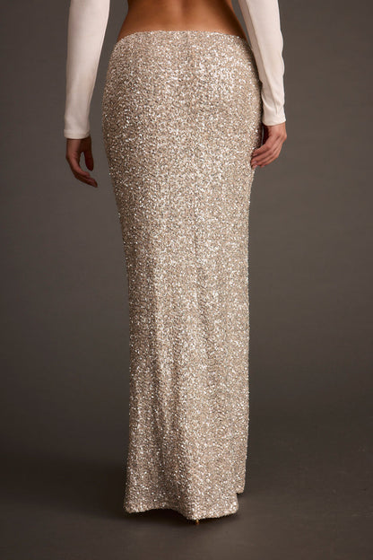 Back view of the champagne maxi skirt showing the silhouette and fit.