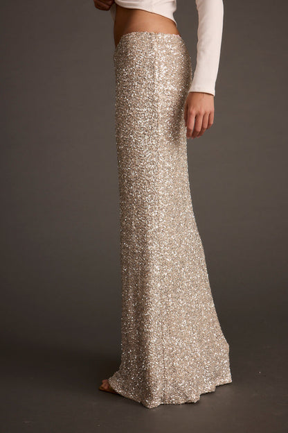 Champagne Nights Maxi Skirt paired with complementary accessories for a polished look.