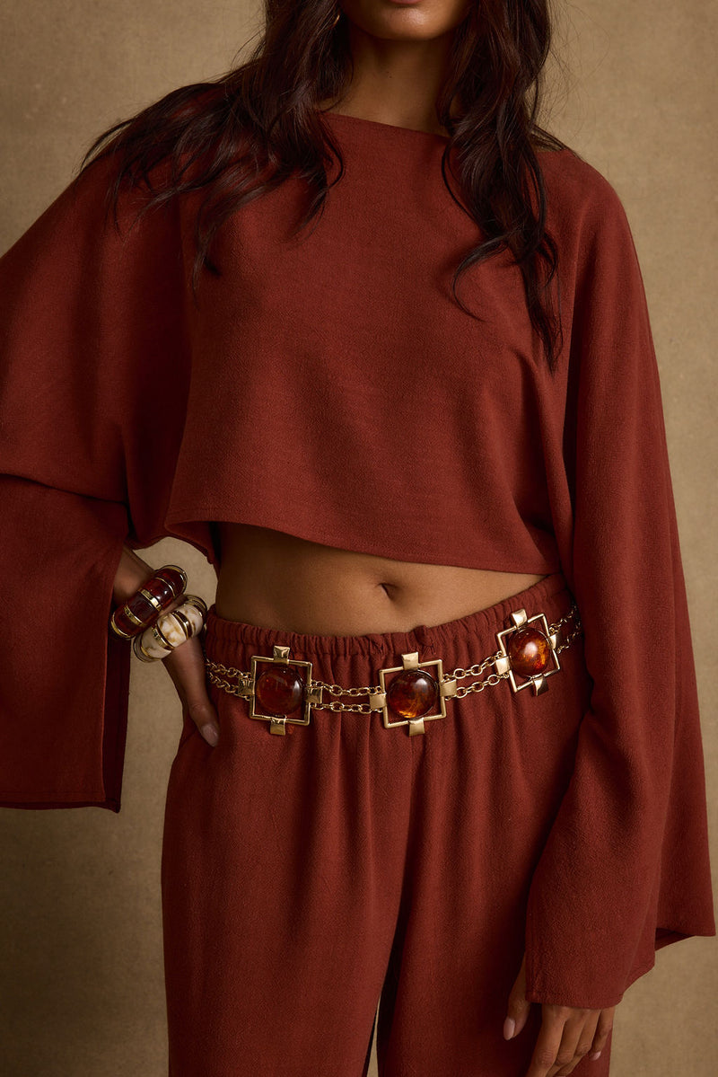 Detail shot of the Clear Breeze Rust Linen Top highlighting the linen elements.