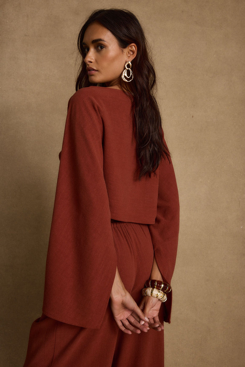 Additional view of the Clear Breeze Rust Linen Top from a different perspective.