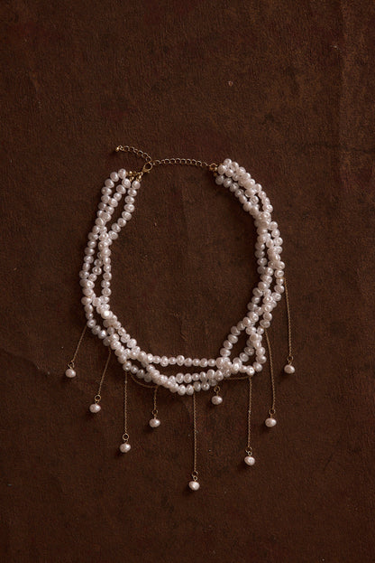 Back view of the pearl piece showing the silhouette and fit.