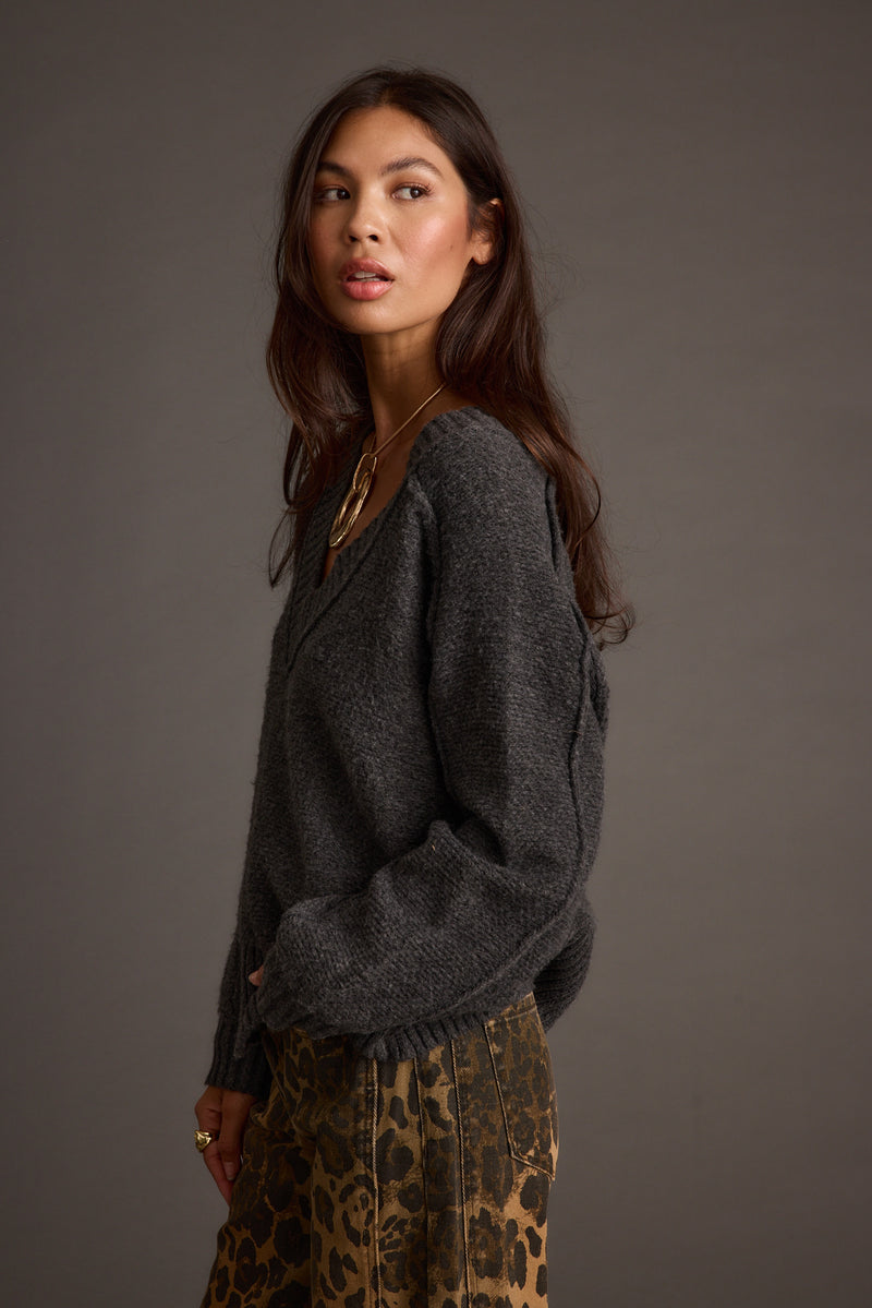 Back view of the sweater showing the silhouette and fit.