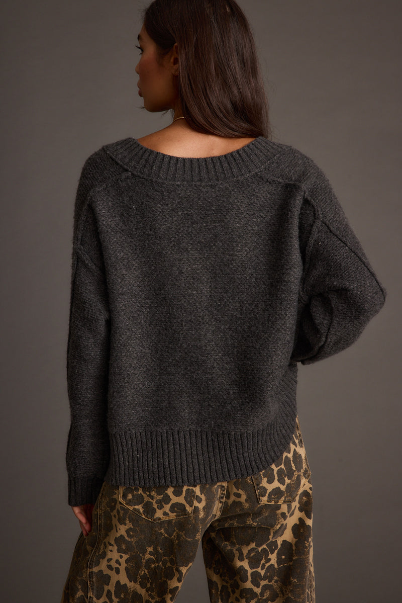 Close-up of the Colorado Charcoal V Neck Sweater showcasing the fabric texture and design details.
