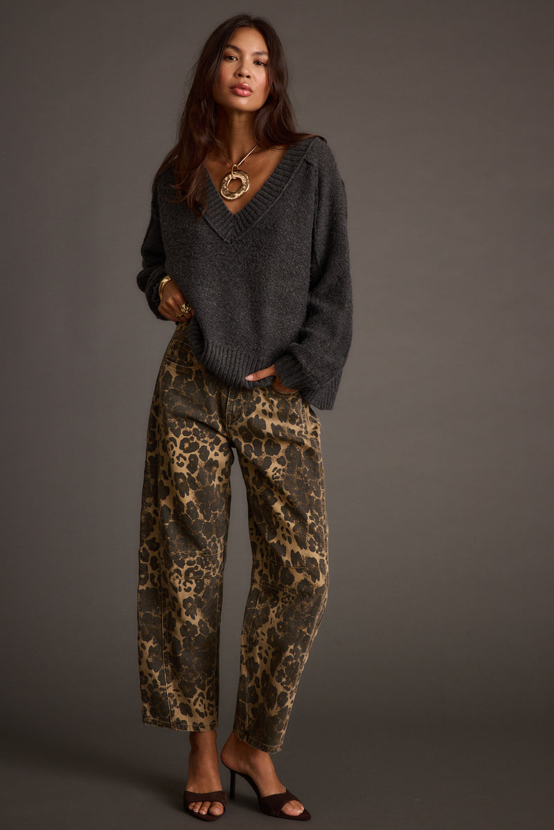 Full-length view of the sweater showing the drape and movement.