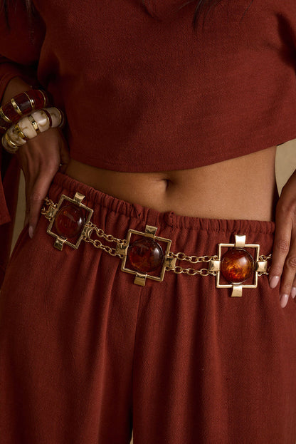Coralli Amber Stone Statement Belt shown as part of a styled outfit ensemble.