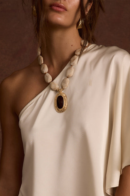 Cressida Pendant Necklace shown as part of a styled outfit ensemble.