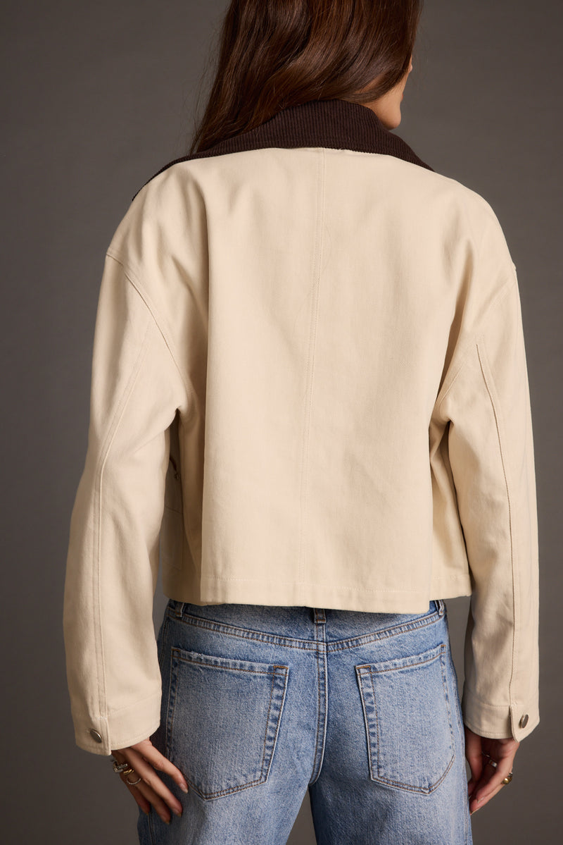 Back view of the khaki barn jacket showing the silhouette and fit.