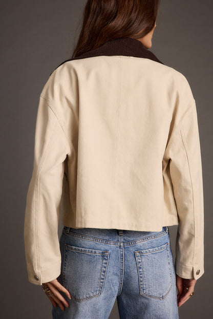 Back view of the khaki barn jacket showing the silhouette and fit.