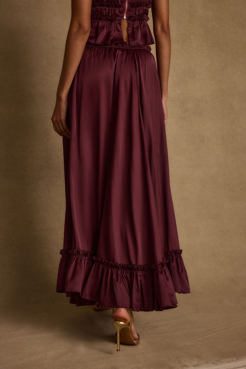 Close-up of the Dahlia Mulberry Satin Maxi Skirt showcasing the satin texture and craftsmanship.