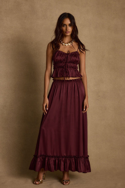 Full-length view of the maxi skirt showing the drape and movement.