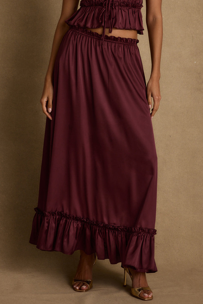 Lifestyle shot of the maxi skirt styled for day-to-night versatility.