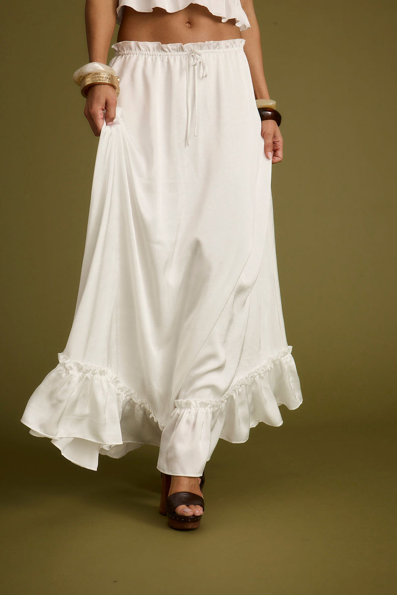 Back view of the white satin maxi skirt showing the silhouette and fit.