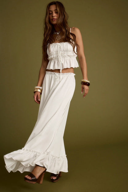 Detail shot of the Dahlia White Satin Maxi Skirt highlighting the satin elements.