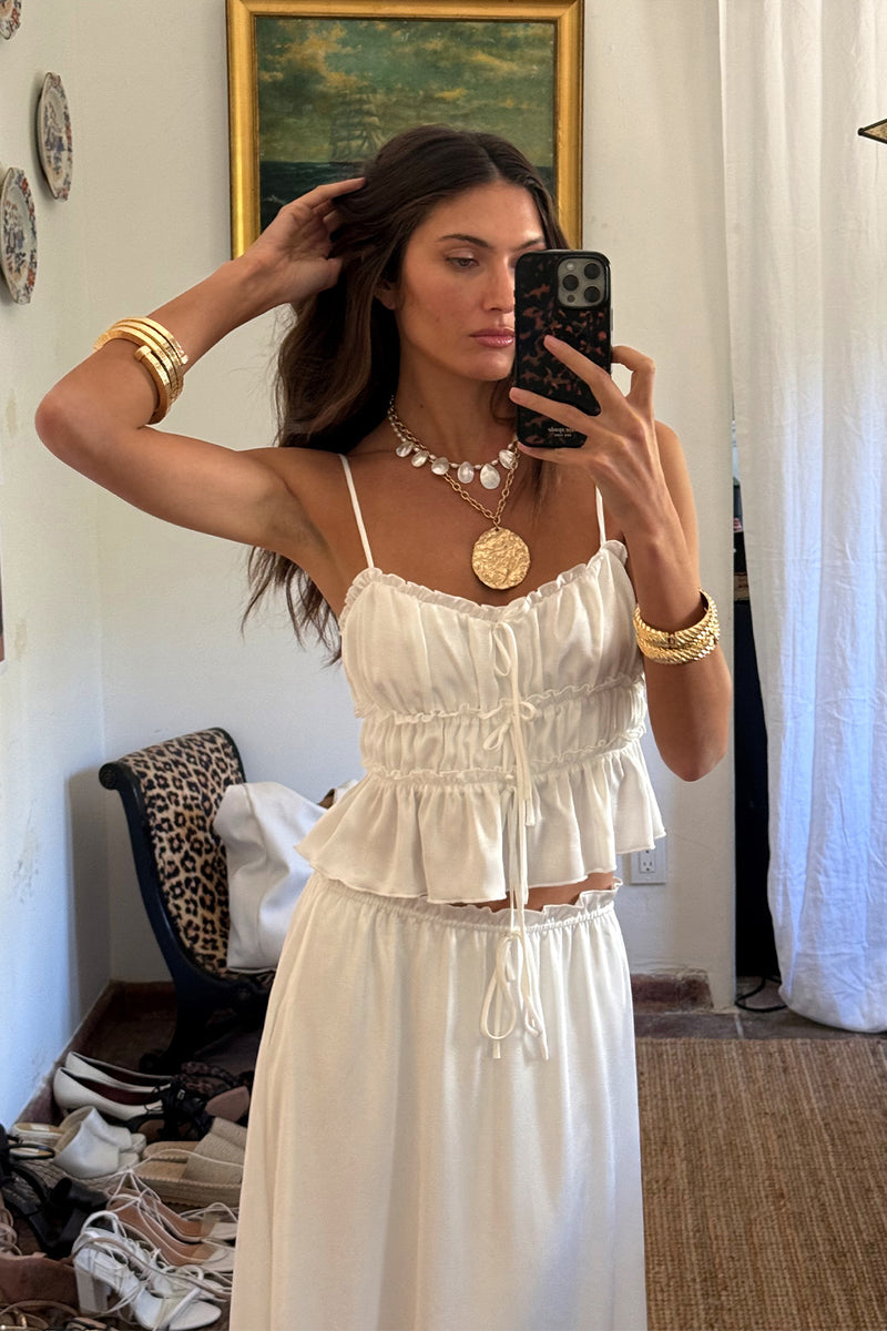 Dahlia White Satin Tank paired with complementary accessories for a polished look.