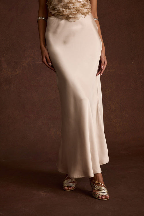 Champagne satin maxi skirt with refined accents, a lace maxi skirt essential.
