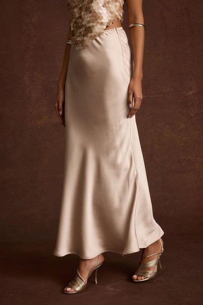 Dolce Champagne Satin Maxi Skirt paired with complementary accessories for a polished look.