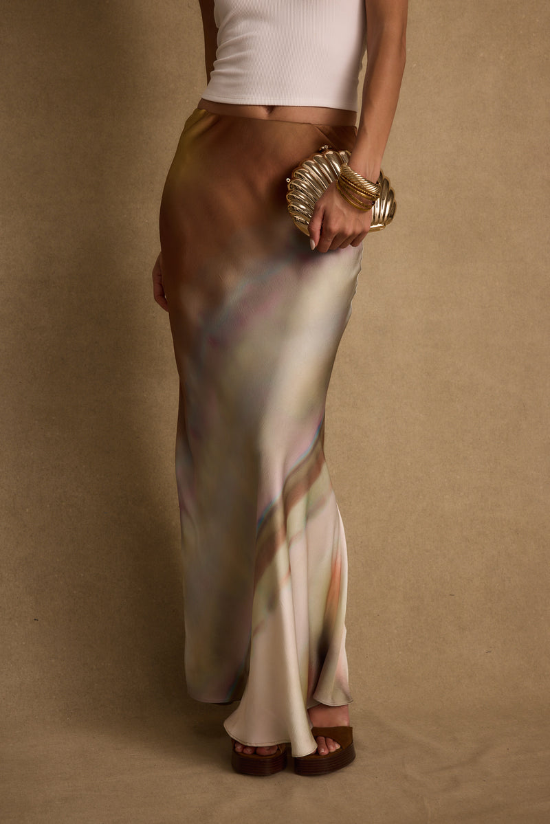 Full-length view of the maxi skirt showing the drape and movement.
