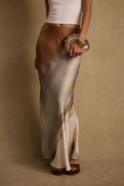 Full-length view of the maxi skirt showing the drape and movement.