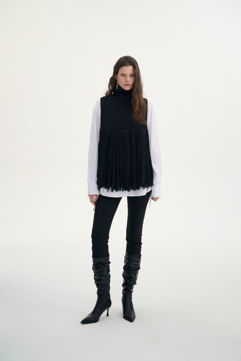 Fringed turtleneck vest