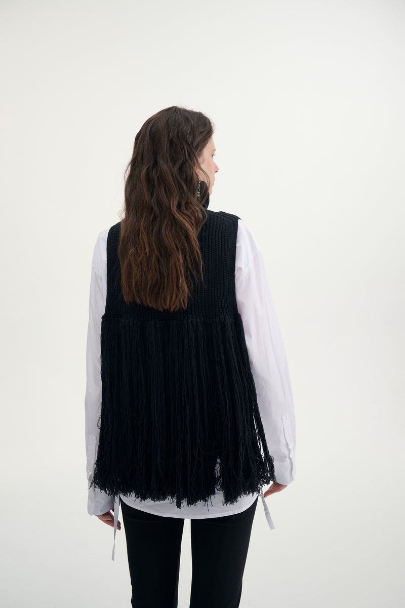 Fringed turtleneck vest