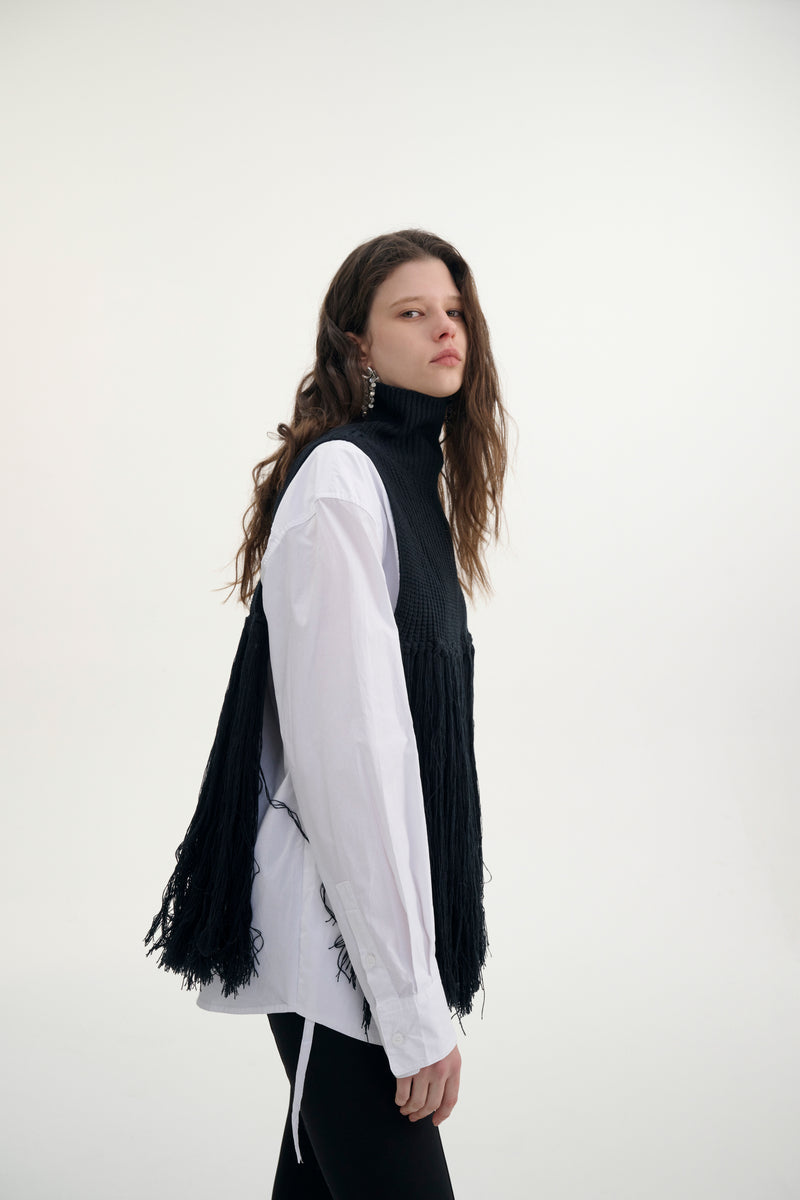 Fringed turtleneck vest