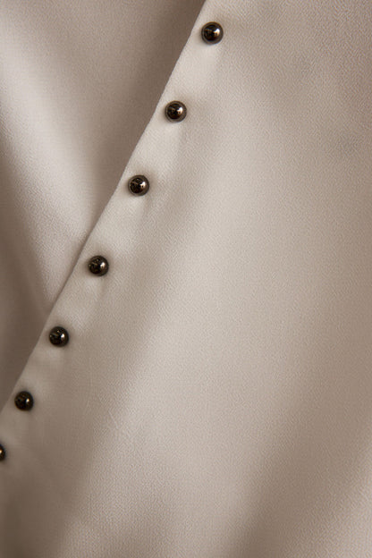 Additional view of the Georgia White Studded Halter Top from a different perspective.