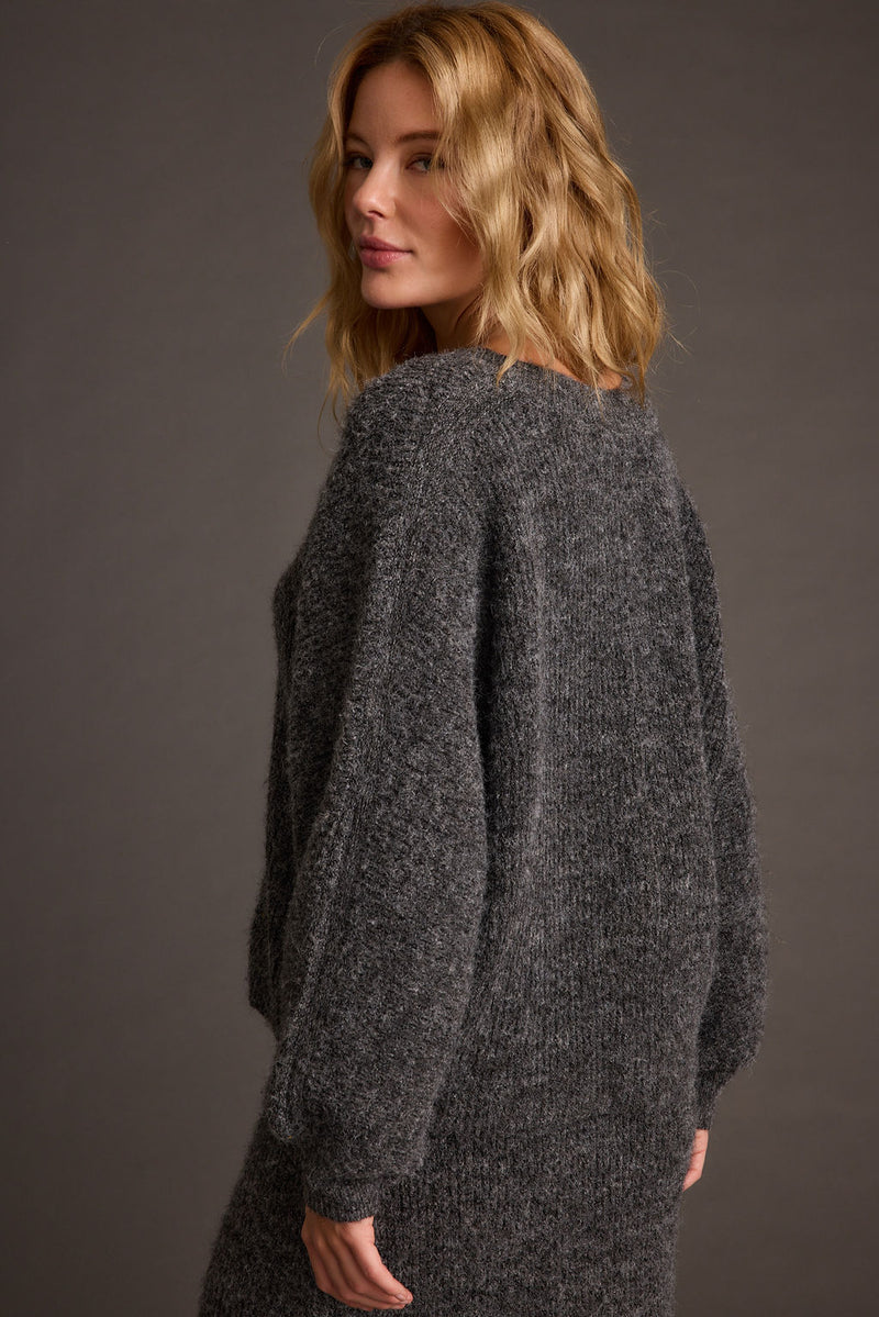 Back view of the sweater showing the silhouette and fit.