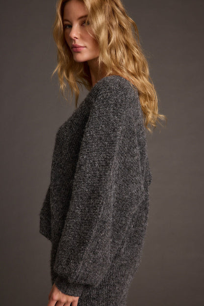 Detail shot of the Glacier Charcoal V Neck Sweater highlighting the V-neck elements.