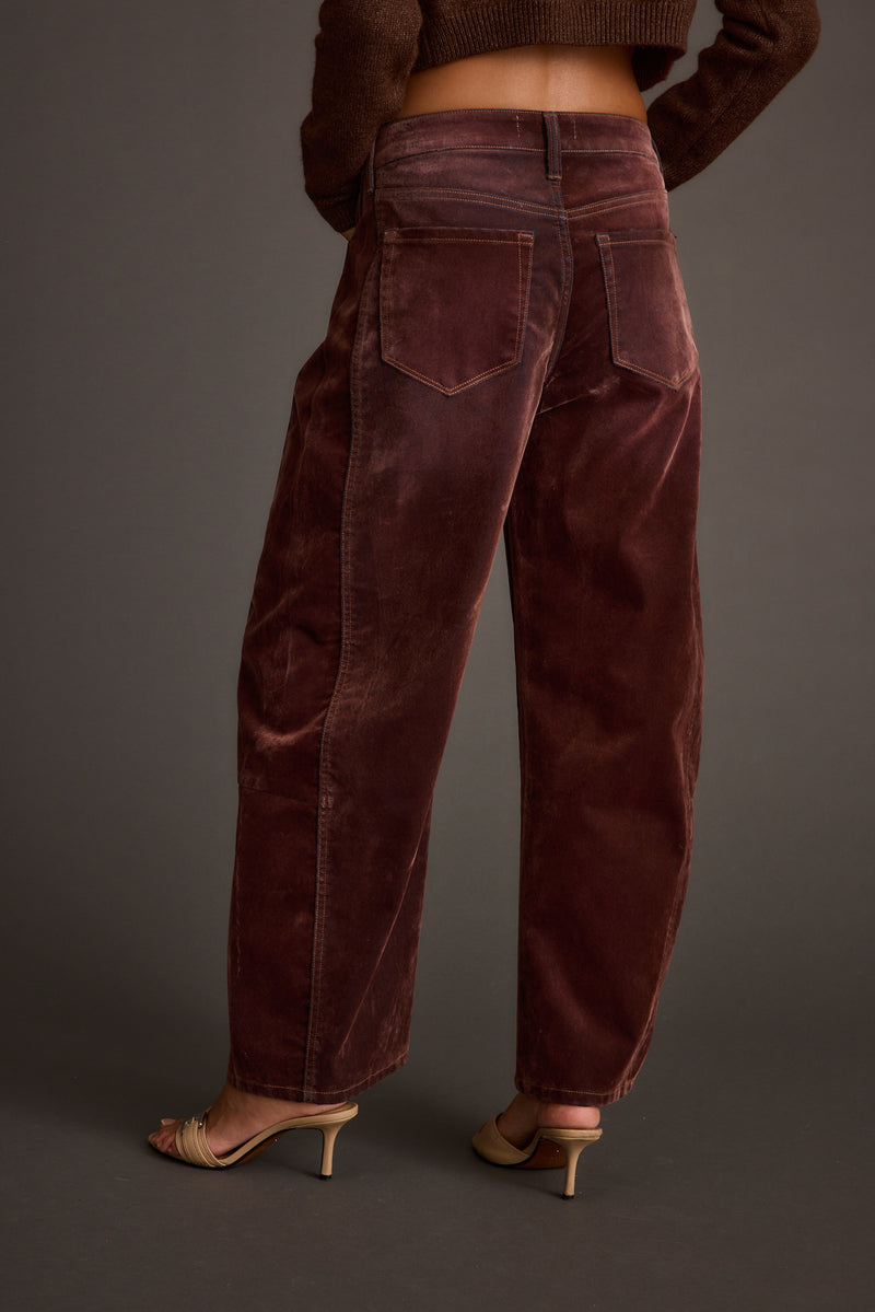 Close-up of the Gracyn Mulberry Velveteen Barrel Pants showcasing the fabric texture and design details.