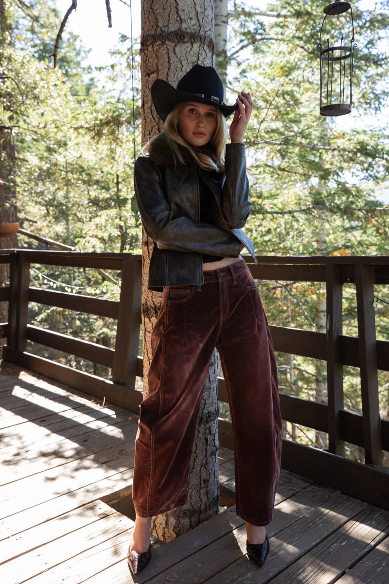 Detail shot of the Gracyn Mulberry Velveteen Barrel Pants highlighting the design elements.
