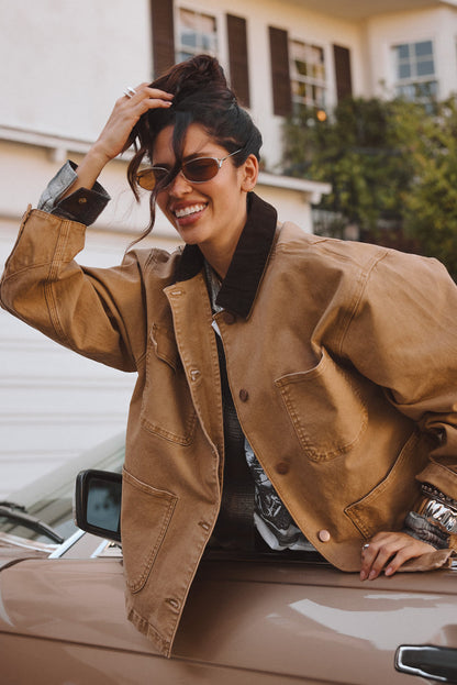 Back view of the khaki barn jacket showing the silhouette and fit.
