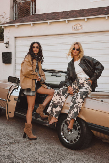 Lifestyle shot of the khaki barn jacket styled for day-to-night versatility.