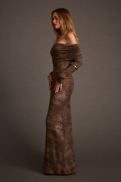 Full-length view of the mocha maxi dress showing the drape and movement.