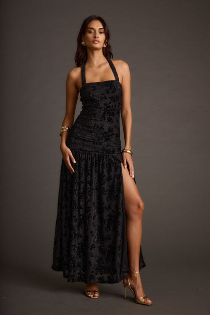Back view of the black maxi dress showing the silhouette and fit.