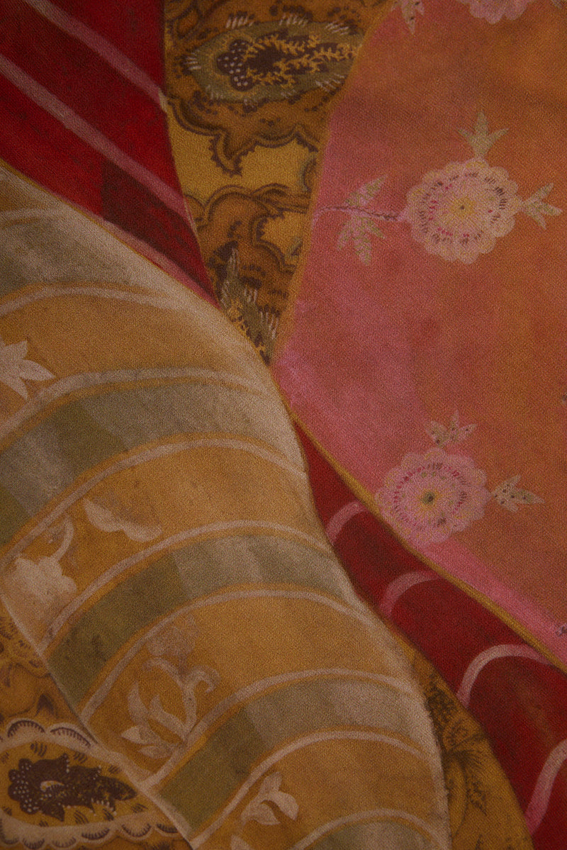 Close-up of Isabella patchwork maxi dress chiffon in pink, mustard, and red floral prints.