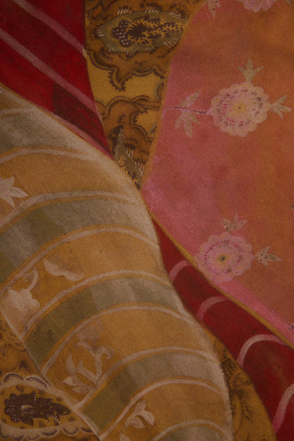 Close-up of Isabella patchwork maxi dress chiffon in pink, mustard, and red floral prints.