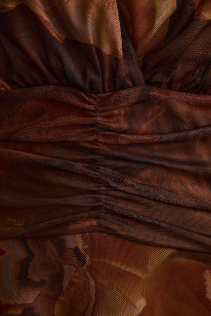 Lifestyle shot of the mocha mini dress styled for day-to-night versatility.