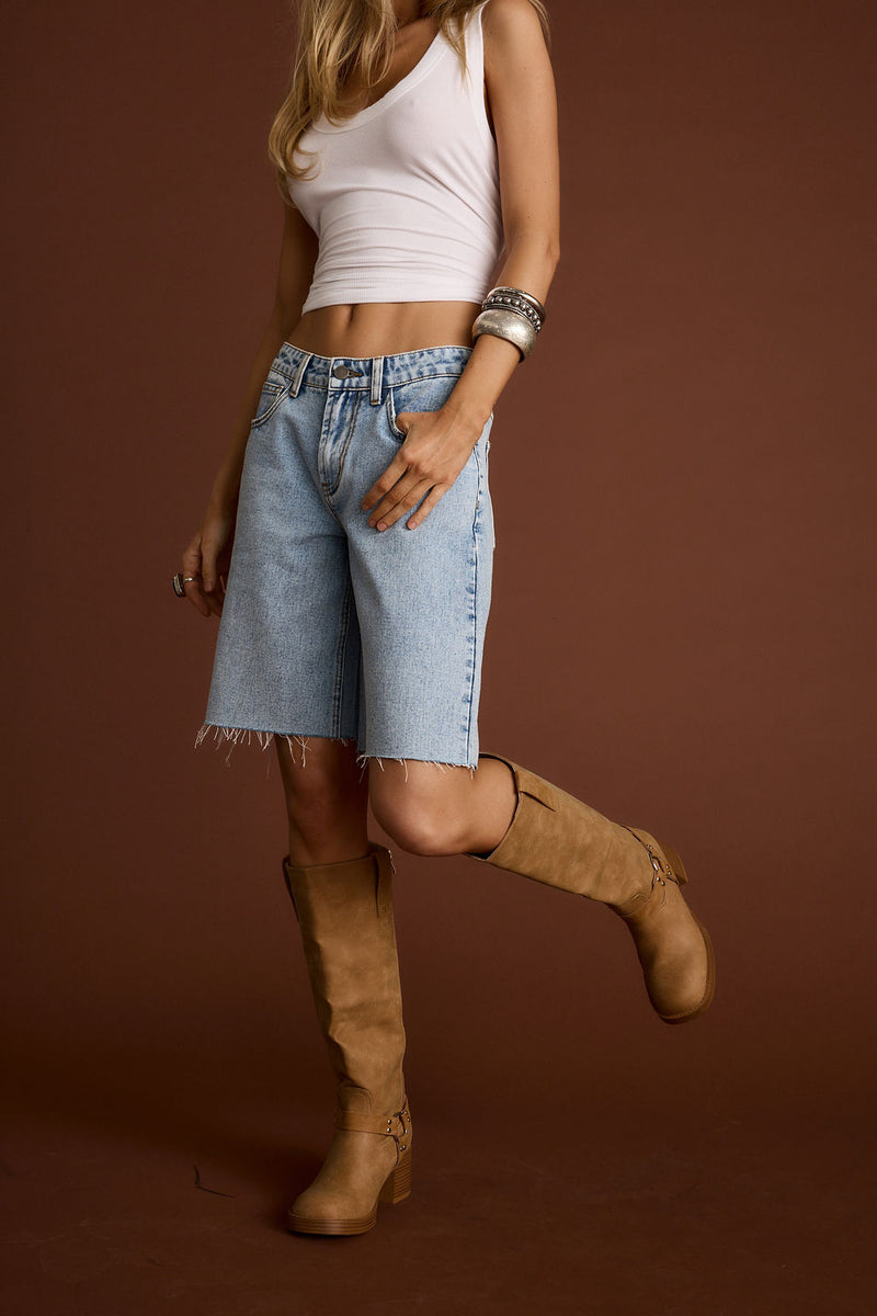Close-up of the Juny Denim Jean Shorts showcasing the denim texture and craftsmanship.