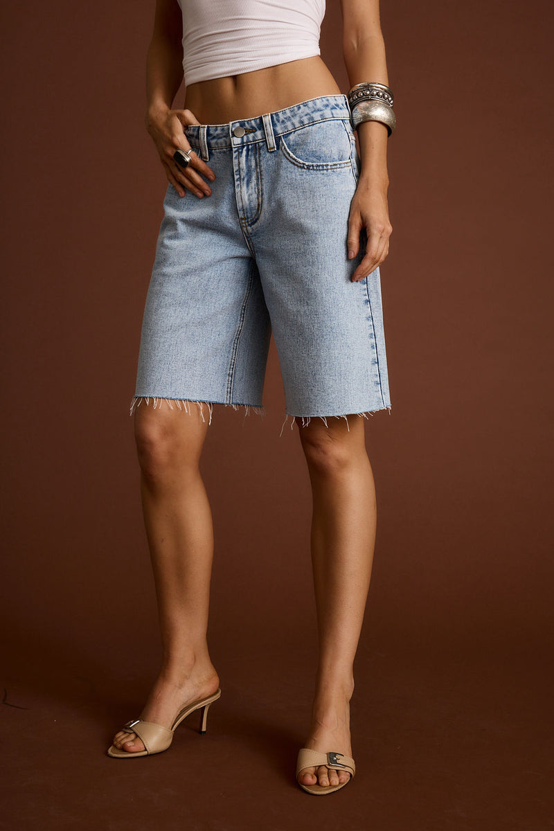 Full-length view of the shorts showing the drape and movement.