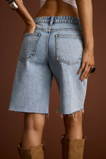 Lifestyle shot of the shorts styled for day-to-night versatility.