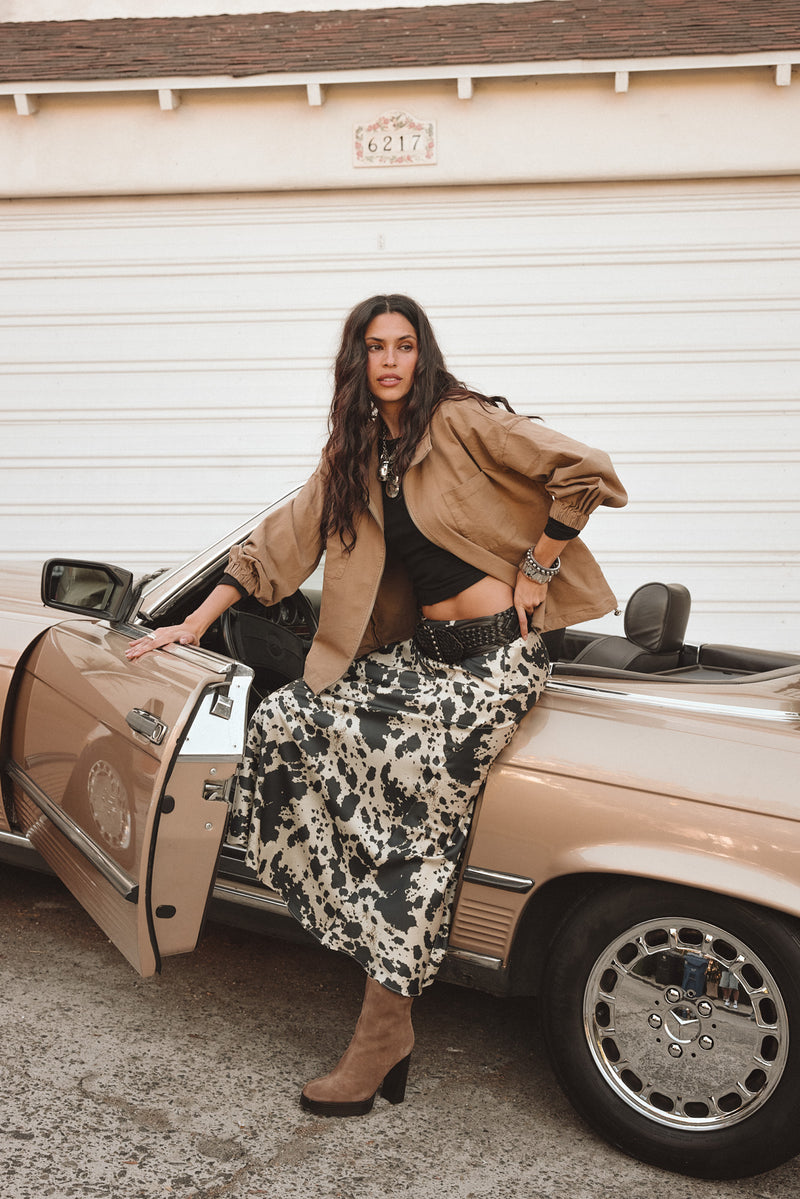 Full-length view of the maxi skirt showing the drape and movement.