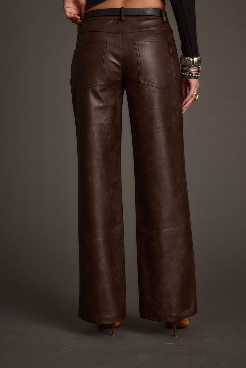 Back view of the espresso vegan leather and leather pants showing the silhouette and fit.
