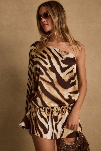 Lifestyle shot of the zebra print mini dress styled for day-to-night versatility.