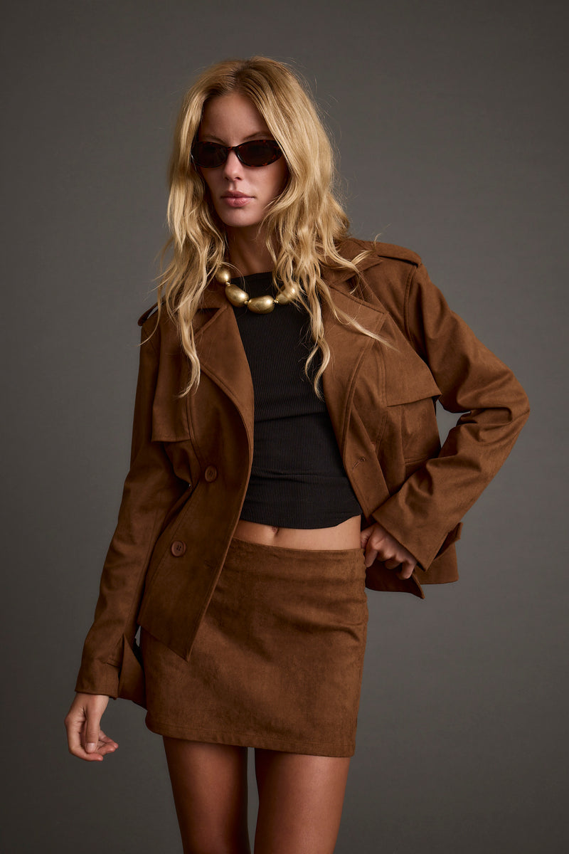 Cognac cropped jacket with refined detailing and a flattering silhouette.