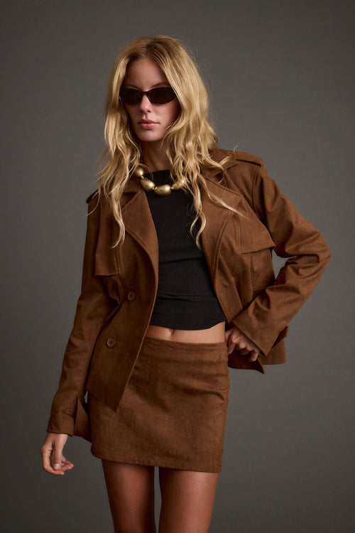 Cognac cropped jacket with refined detailing and a flattering silhouette.