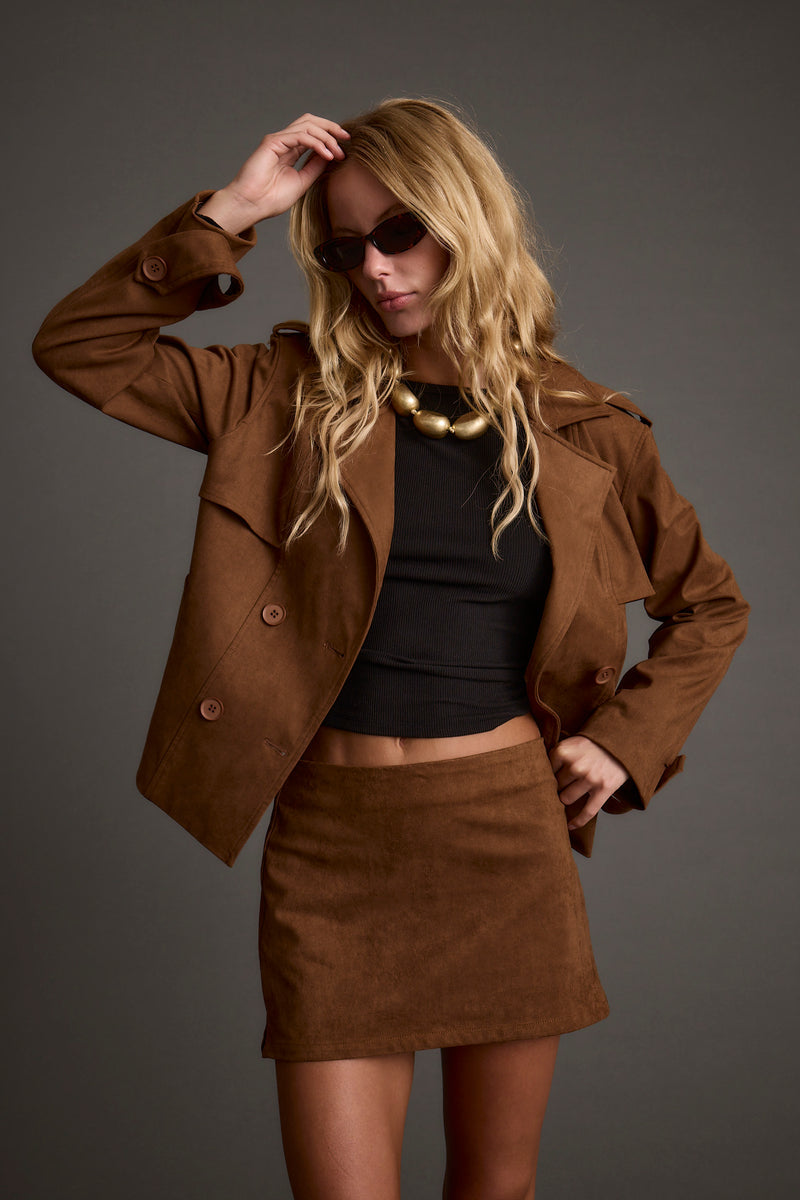 Detail shot of the Kinsey Cognac Vegan Suede Cropped Trench highlighting the cropped elements.