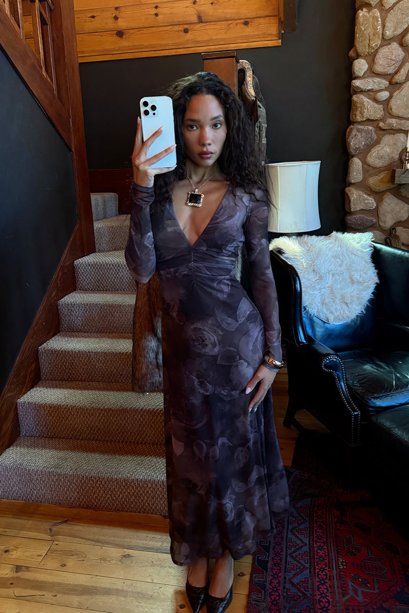 Lifestyle shot of the plum maxi dress styled for day-to-night versatility.