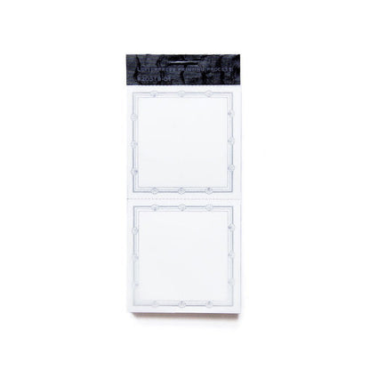 a packet of book labels with two perforated labels per sheet